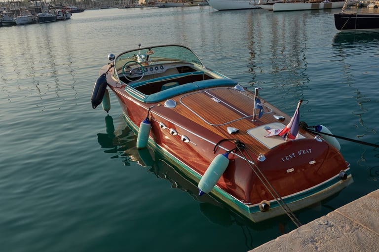Elegant wooden Riva speed boat with classic design moored in a tranquil marina