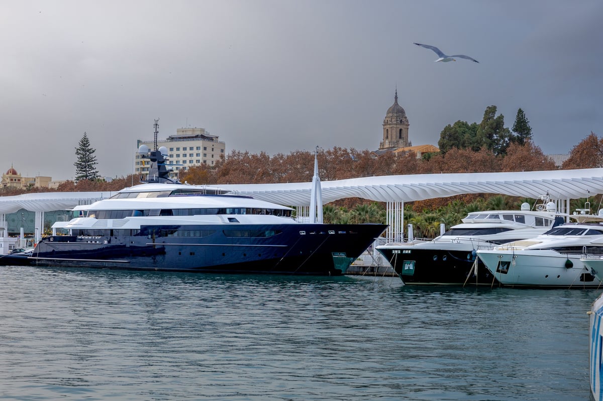 Luxury yachts docked in Malaga harbor on the Mediterranean coast.