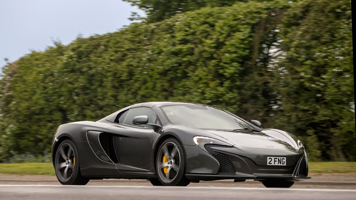 McLaren 650s supercar driving on British road