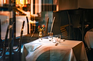 Elegant intimate dining room with candlelit table setting for two