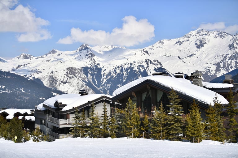 Luxury ski chalets on snowy slopes
