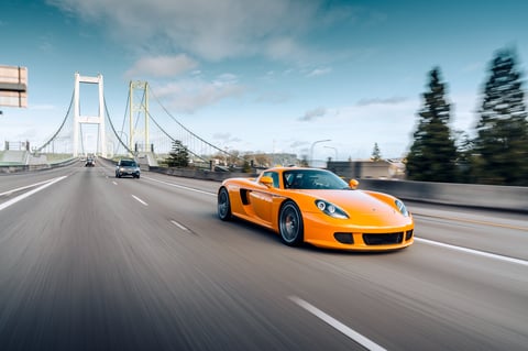 Porsche Carrera GT driving on the street