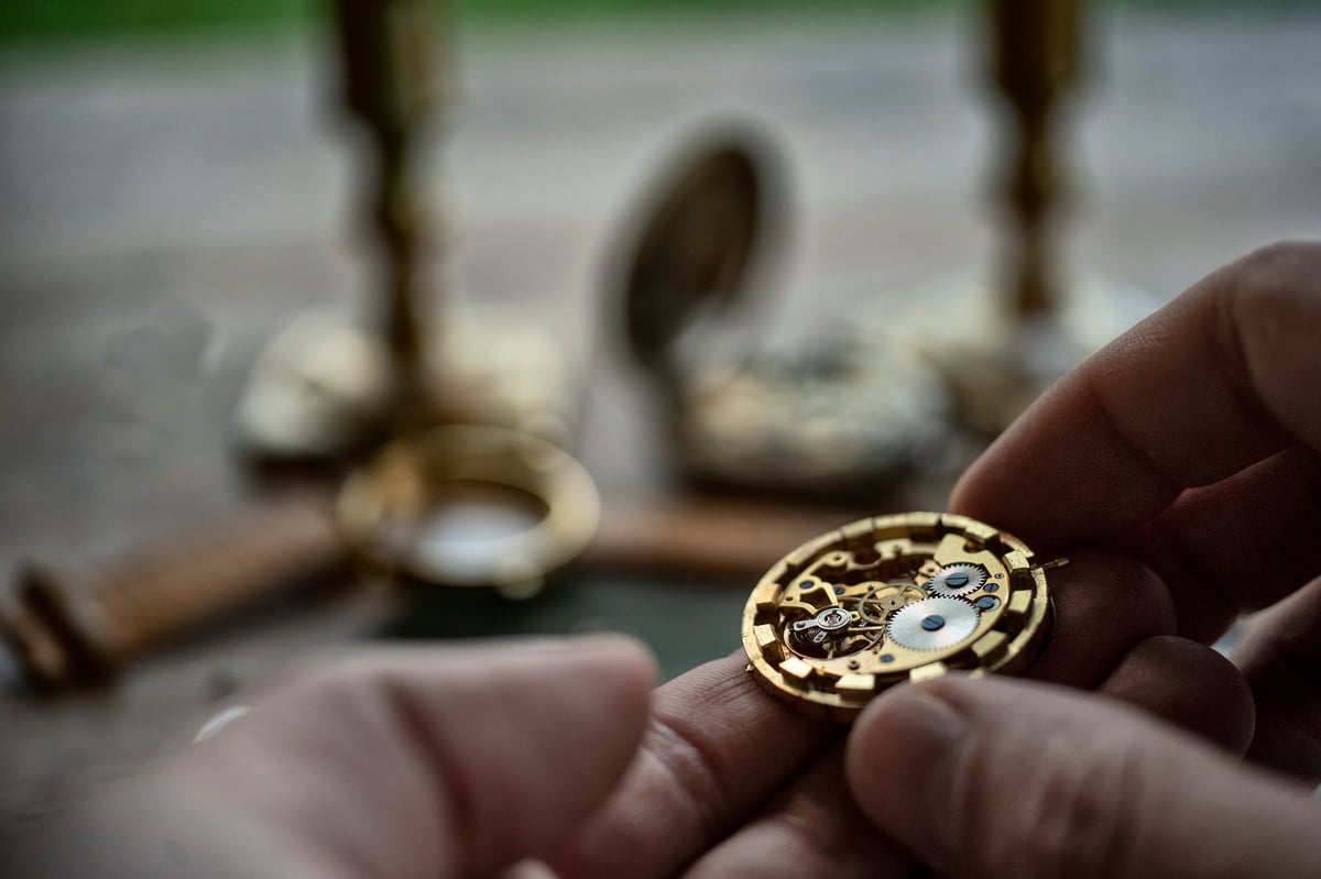 Traditional watchmaker workshop with vintage mechanical watches and tools
