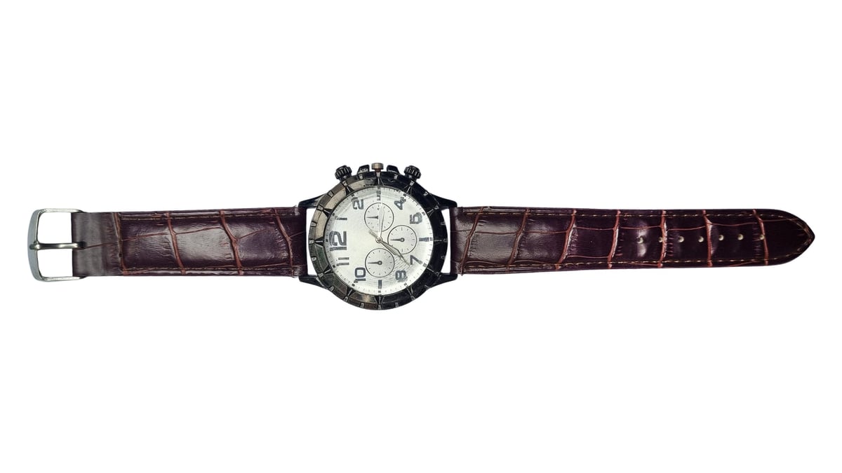 Studio shot of a men's chronograph watch with brown crocodile leather strap