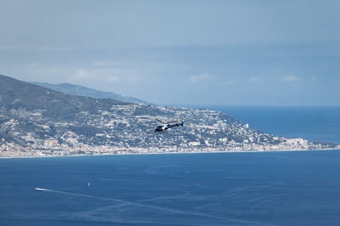 Helicopter flies over the French Riviera during Formula 1 Monaco Grand Prix
