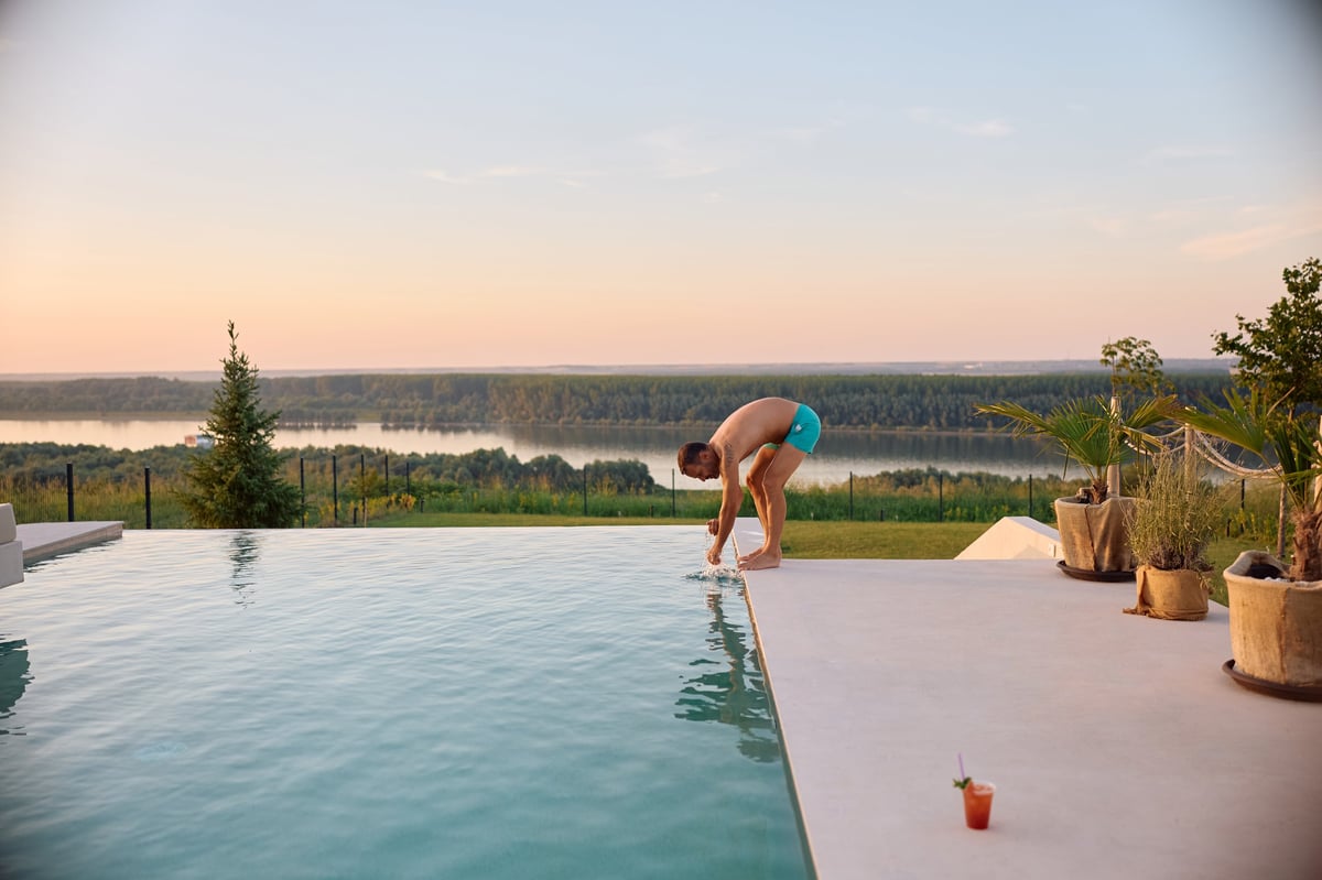Luxury resort pool in Bali with tropical landscape