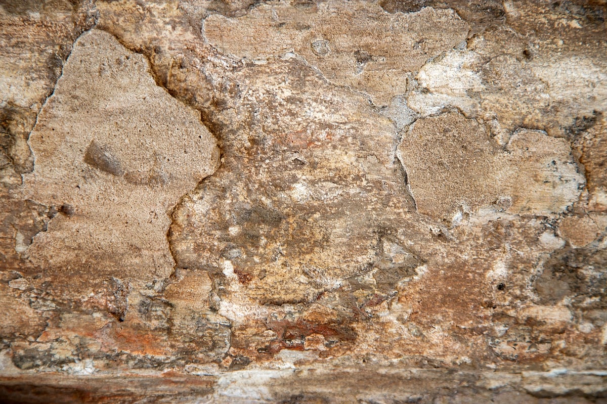 Ancient weathered stone wall