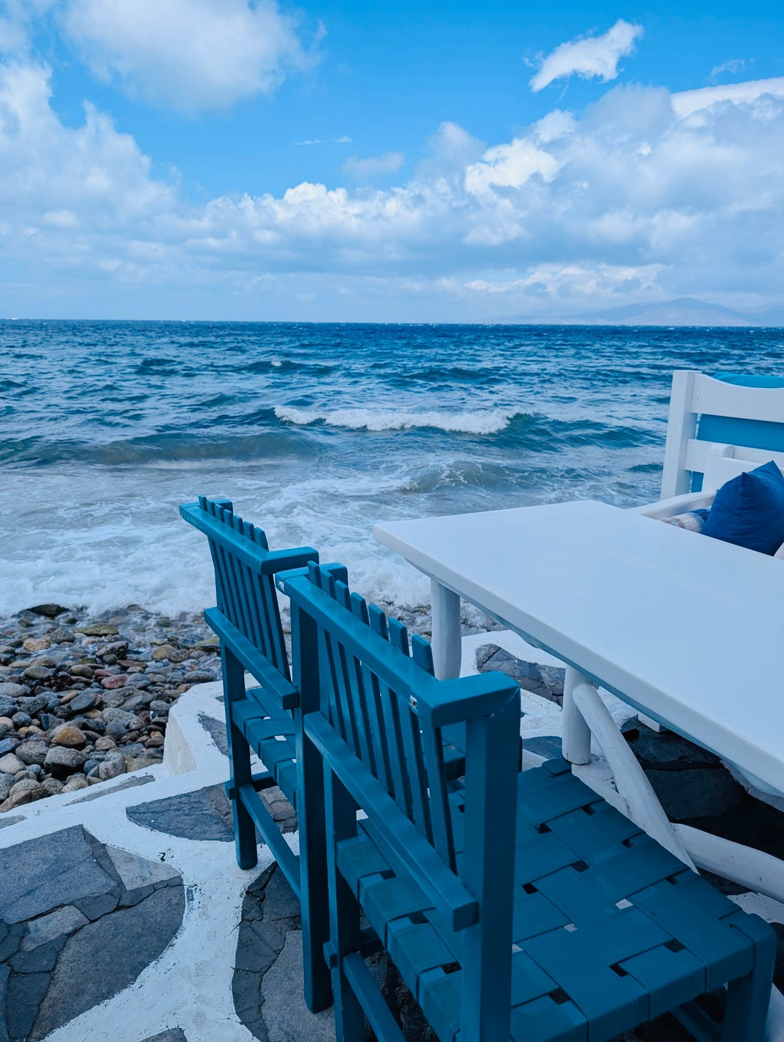 Waves break beneath the balconies of the historic seafront houses of Alefkandra, known as Little Venice, in Mykonos Town.