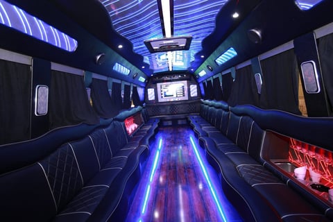 Luxury party bus interior with LED lighting and premium bar