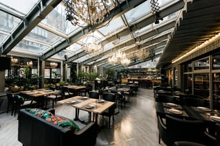Stylish empty cafe with arranged tables and chairs