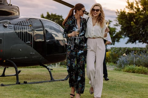 Helicopter transfer with champagne welcome