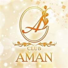 Logo for Club Aman featuring a gold stylized A initial within an oval frame on a cream bokeh background