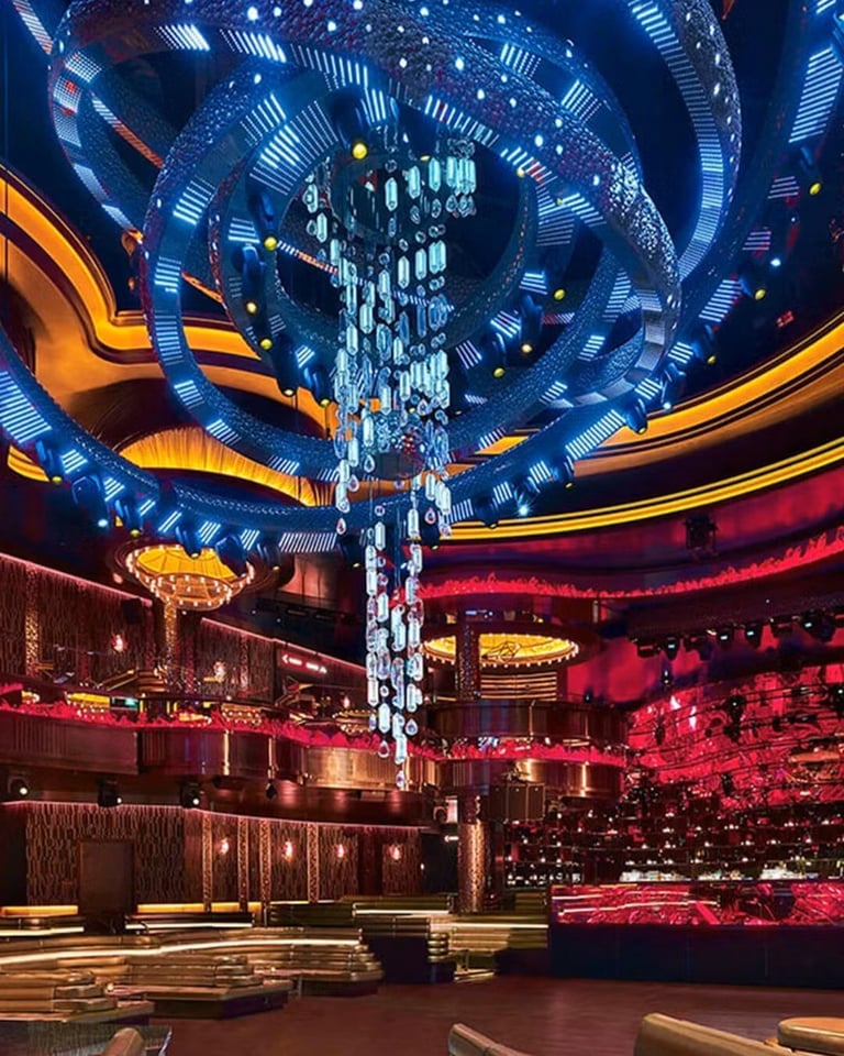 Modern nightclub interior with vibrant blue, orange, and red neon lighting and intricate geometric ceiling designs