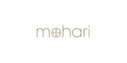 Mohari logo featuring tan text with a decorative geometric symbol in the center