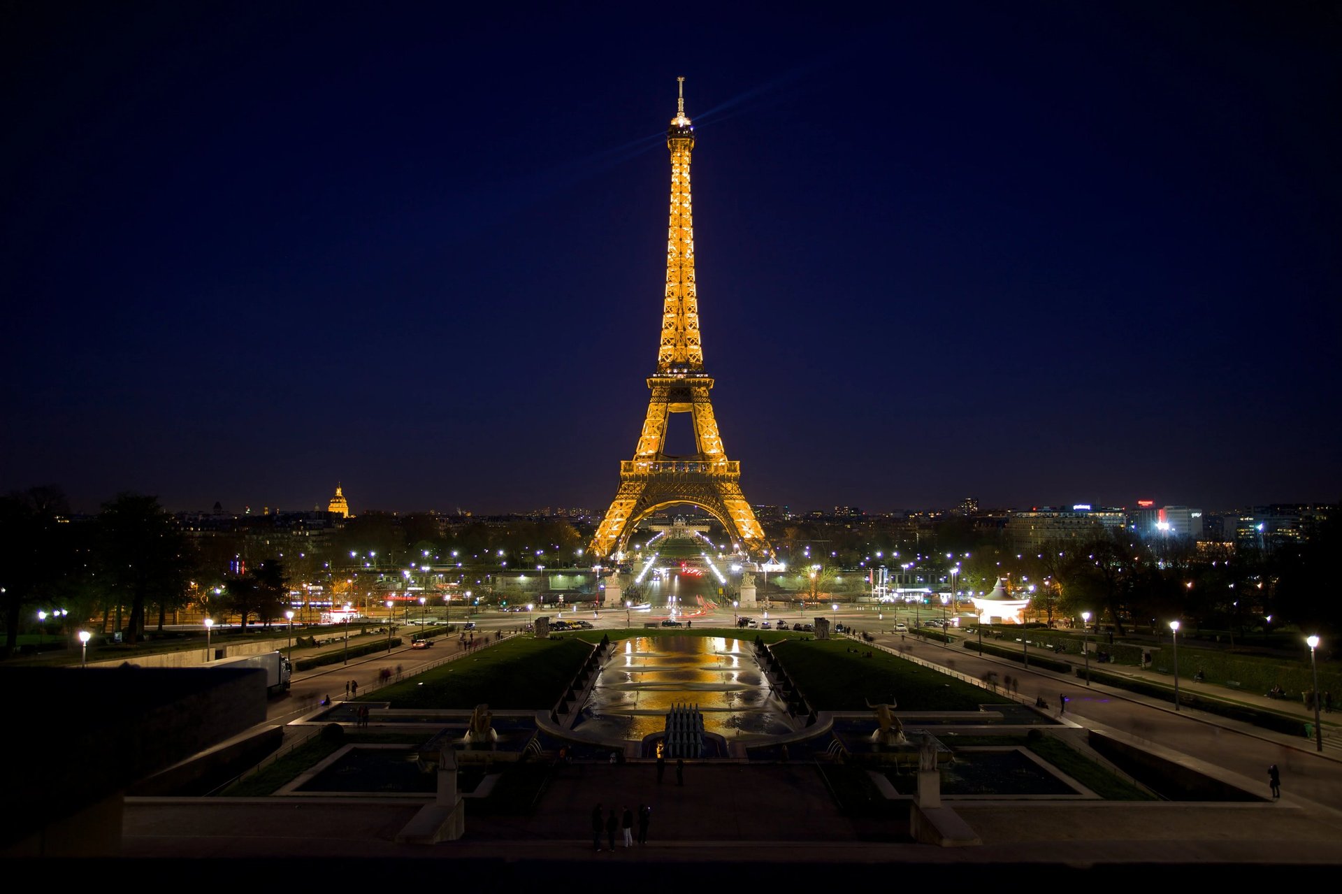 Eiffel Tower illuminated at night in Paris, golden lights over the City of Light