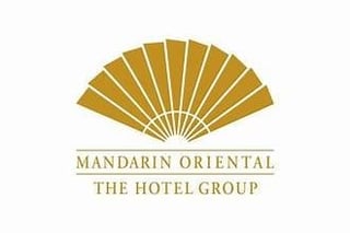 Mandarin Oriental The Hotel Group logo featuring a stylized gold fan design