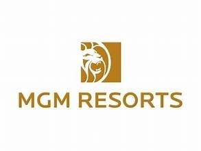 MGM Resorts logo featuring a stylized lion head design in gold with company name text below