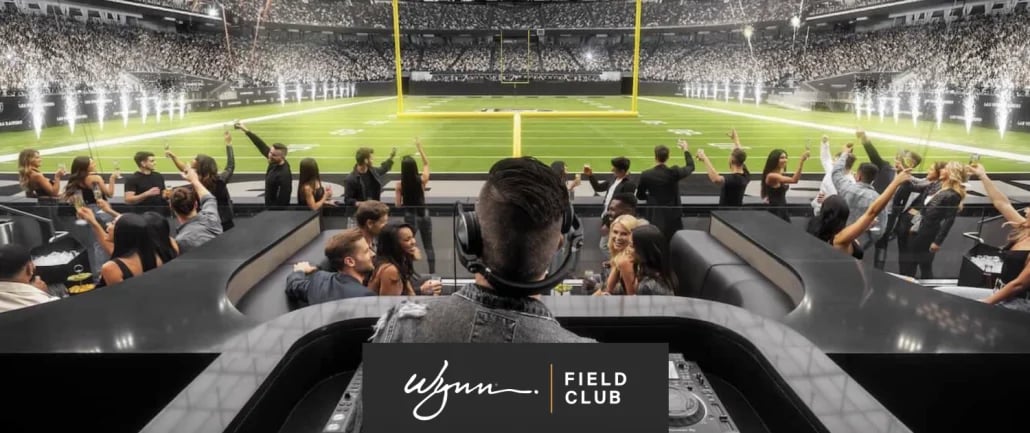 Wynn Field Club luxury suite view overlooking packed football stadium from elevated seating area