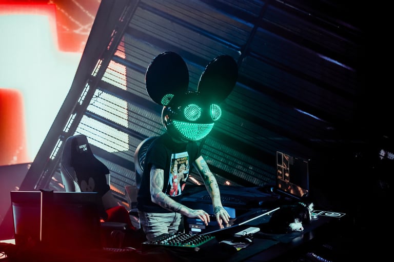 Mau5head helmet DJ performing with neon stage lighting